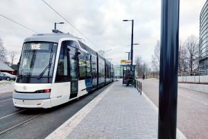 Tram test ride in front of the Viikki library